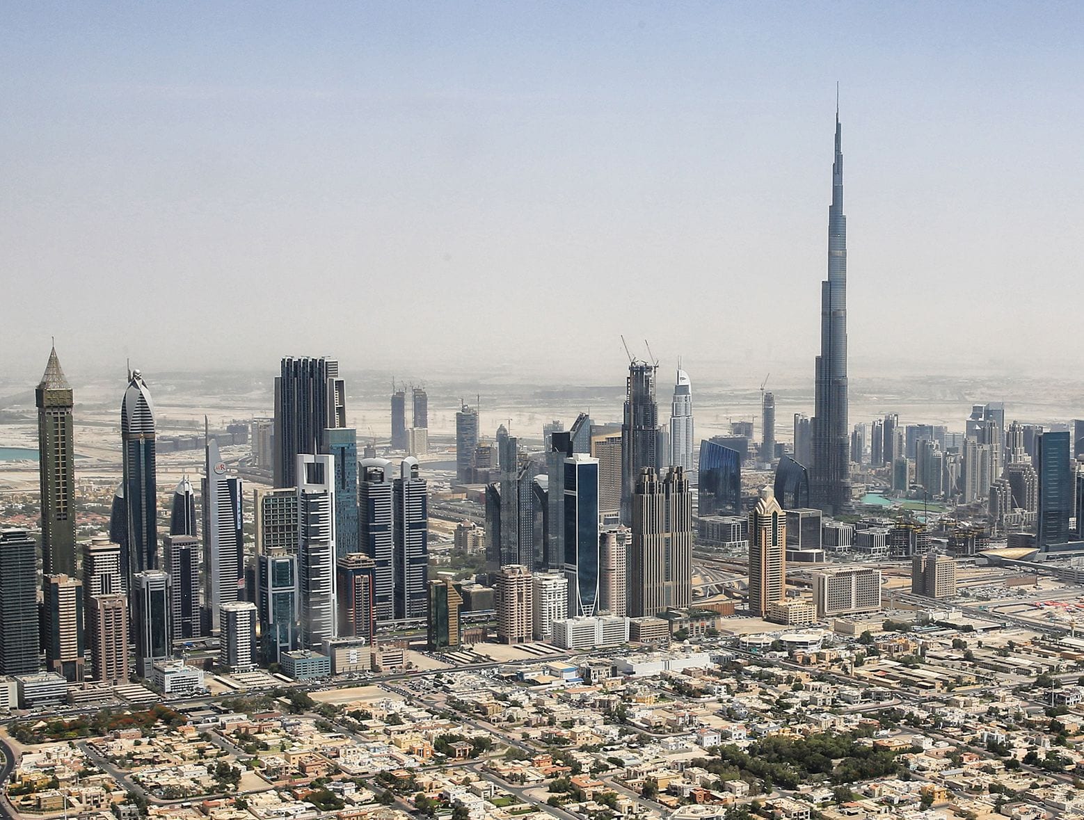 Downtown Dubai skyline with the Burj Khalifa, seen from a helicopter