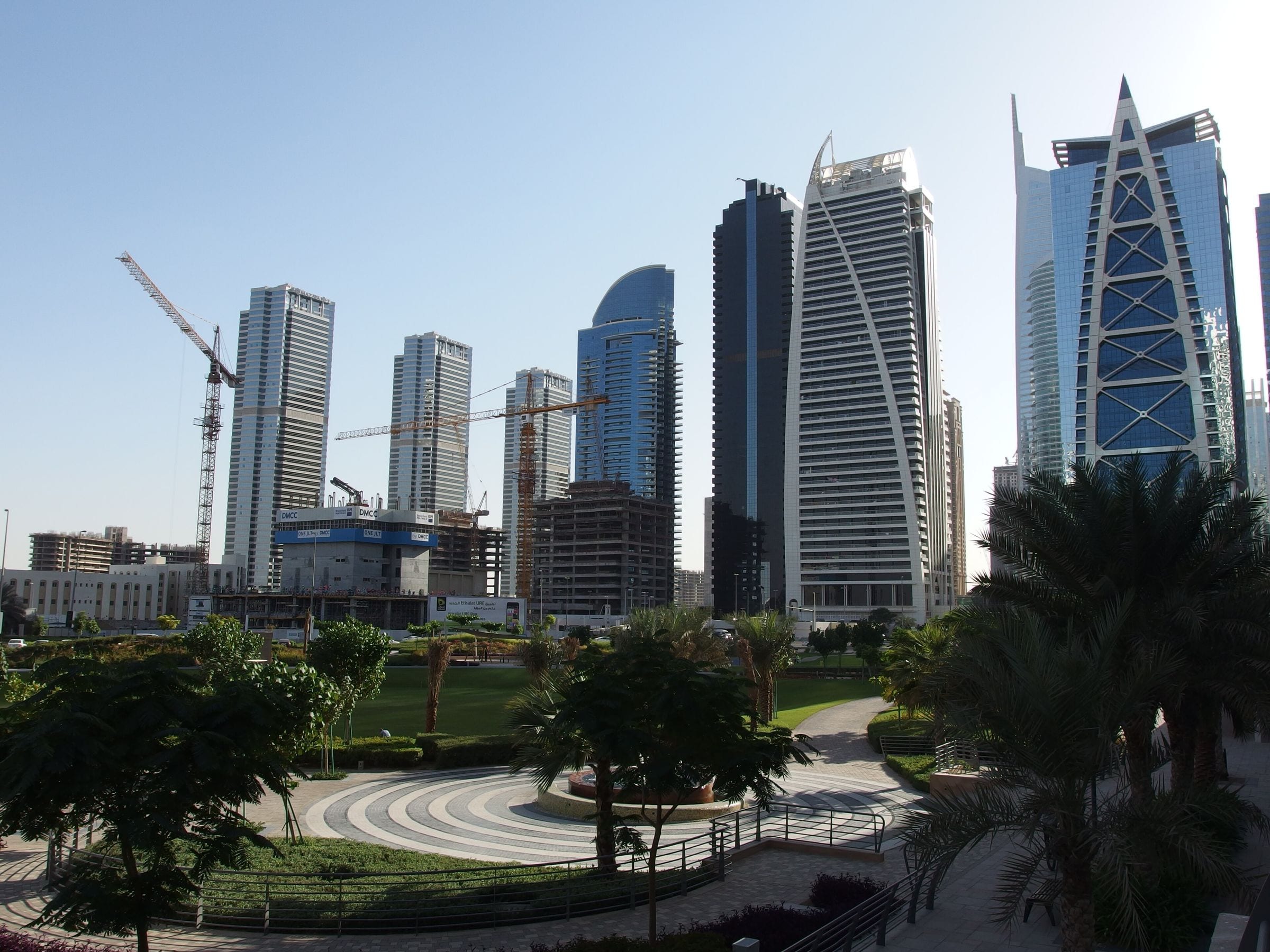 Jumeirah Lake Towers park with the cluster towers rising behind it